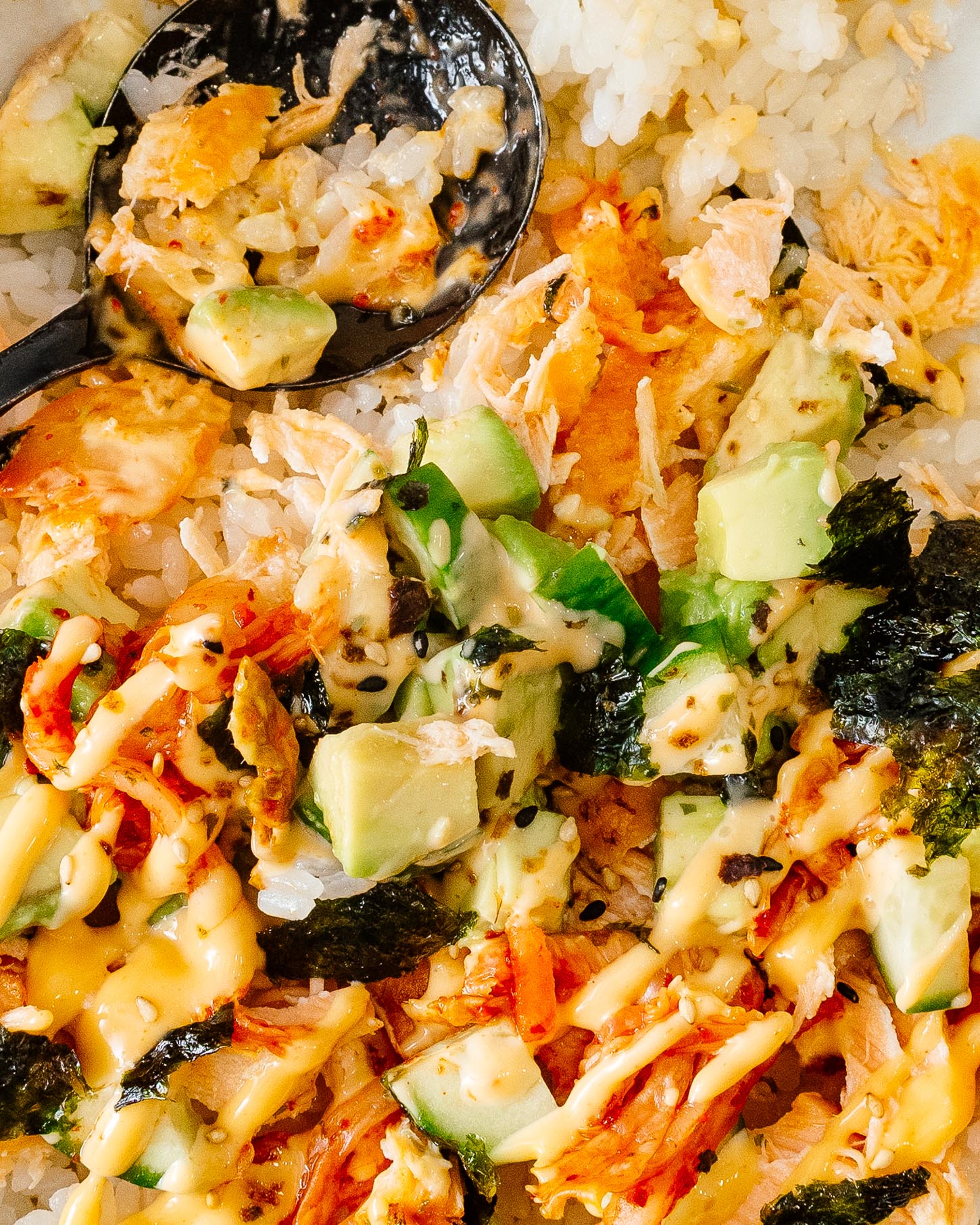 All mixed up: warm rice, flaky salmon, creamy avocado, crunchy cucumber, kimchi and Kewpie